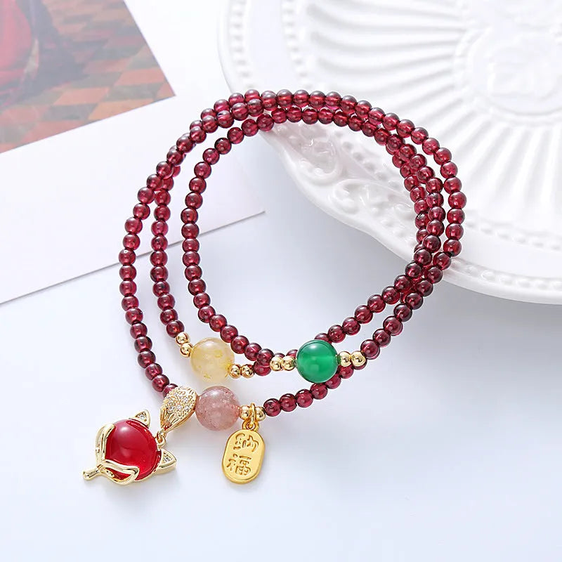 Purplish red garnet fox charm bracelet with adjustable rope closure for women