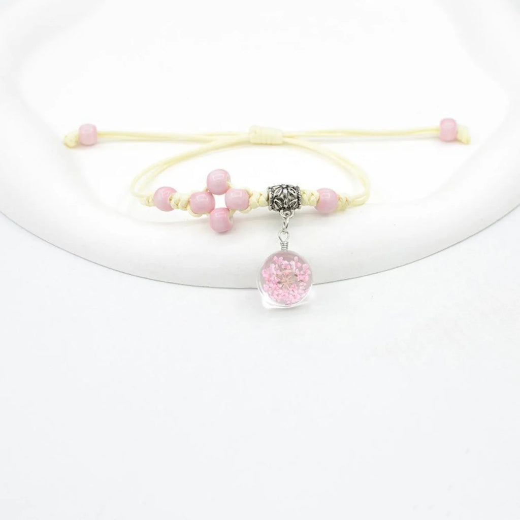 Glass dried flower bracelet for women with large 1.4cm bead and lace charm in multiple colour choices.