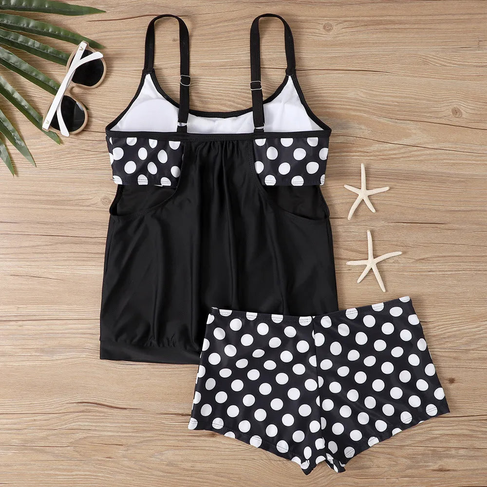 Women's black polka dot high-waist boxer swimsuit briefs made from polyester fabric.