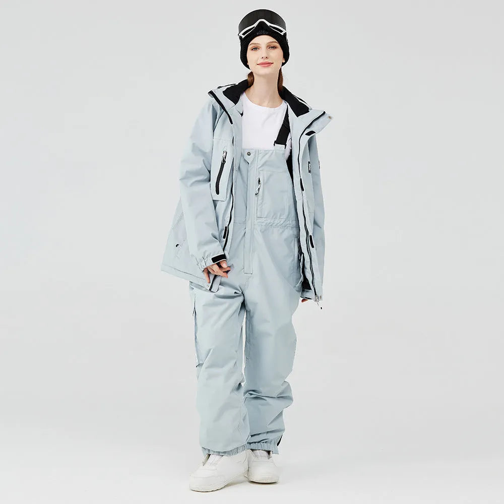 Blue and black unisex winter ski suit jacket and pants for snow sports.