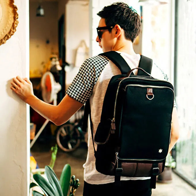 Modern men's Oxford cloth backpack in army green colour, showing large main compartment.