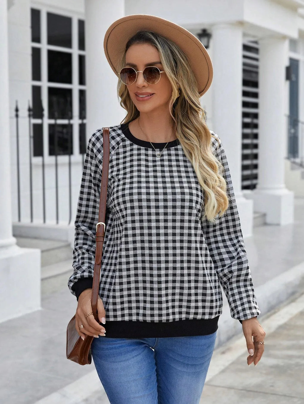 Black long sleeve polyester sweater with striped plaid print pattern