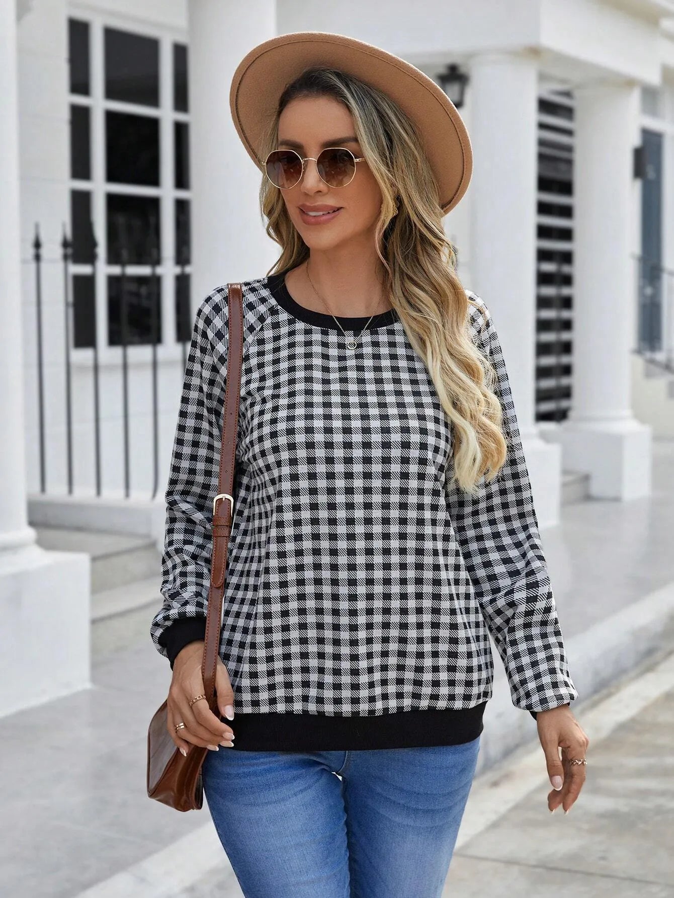 Black long sleeve polyester sweater with striped plaid print pattern