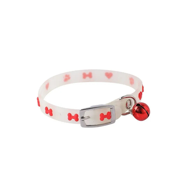 Cat luminous collar with adjustable silicone strap and metal bell showing paw print pattern