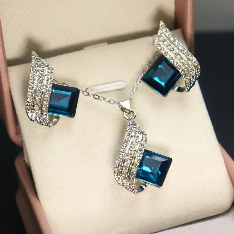 Women's alloy and glass cross chain necklace with matching electroplated stud earrings jewellery set