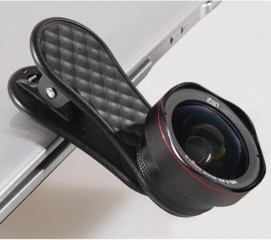 Black mobile phone wide-angle and macro camera lens kit with storage box and clip on a white background.