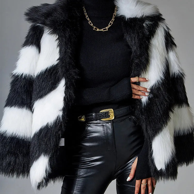 Picture Colour faux fur coat with dark contrast lapels and a matching fur collar.