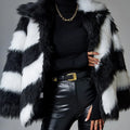 Picture Colour faux fur coat with dark contrast lapels and a matching fur collar.