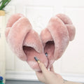 Women's black cross open-toe fur slippers with a patterned non-slip sole.