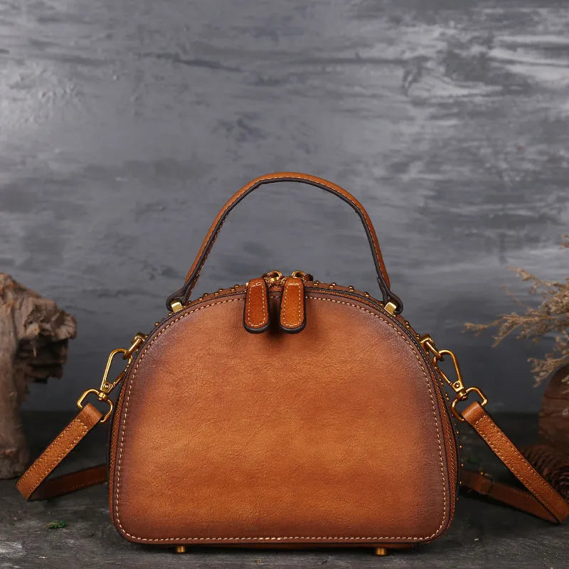 Vintage suede leather handbag in graphite ash showing interior ID, phone, and zipper pockets.