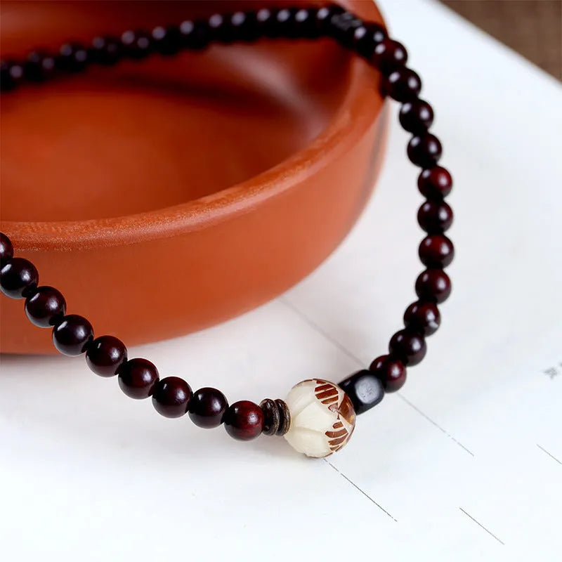 Natural rosewood double-ring bracelet with knitting construction and flower pattern elements