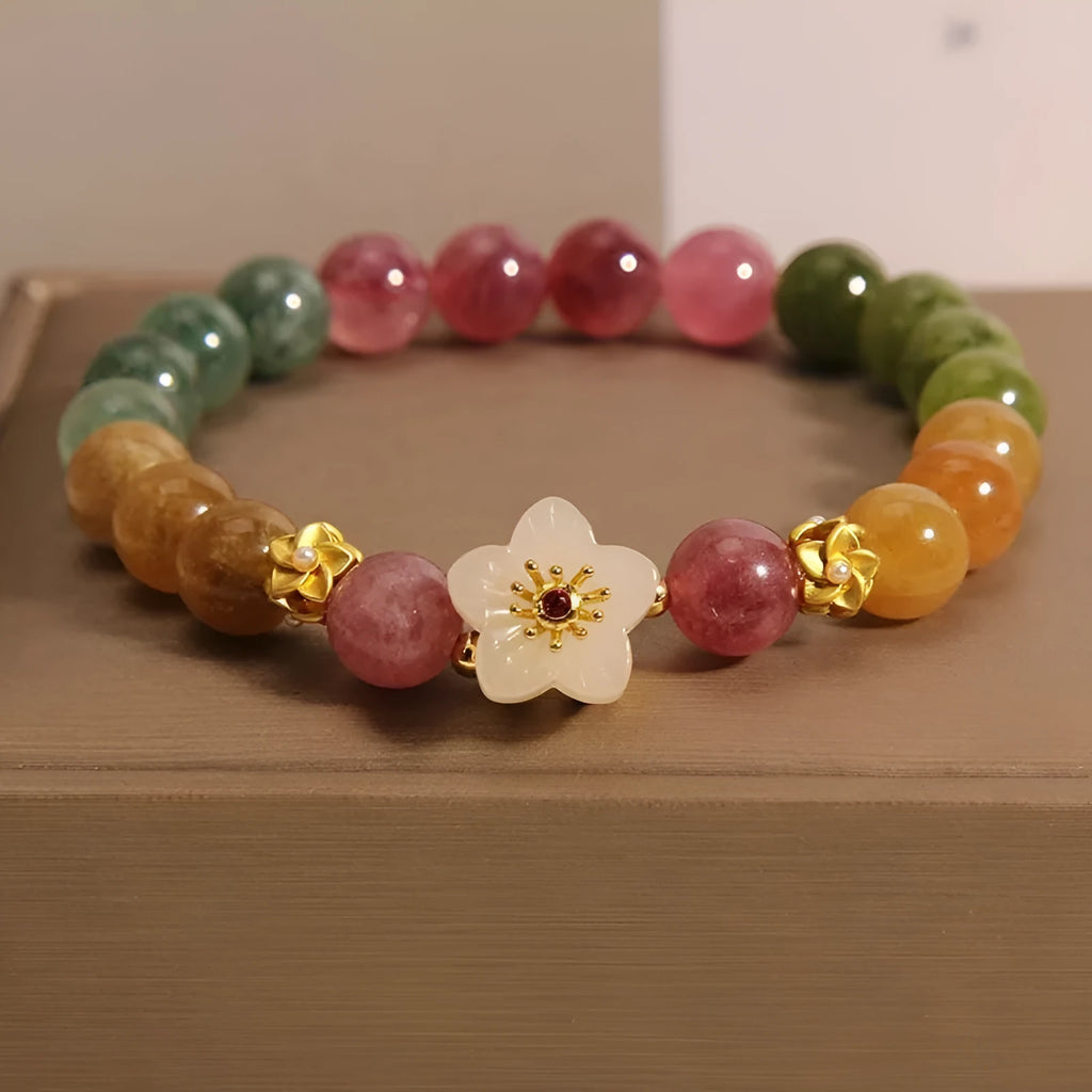 Natural colour tourmaline bracelet with floral and fu character designs on geometric casual jewellery