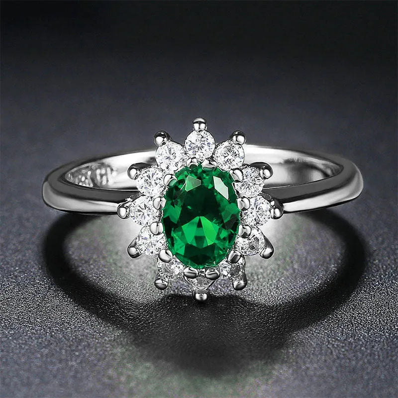 Women's copper flower-shaped ring with inlaid zirconium stones in green, blue, or red.