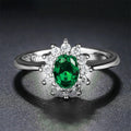 Women's copper flower-shaped ring with inlaid zirconium stones in green, blue, or red.