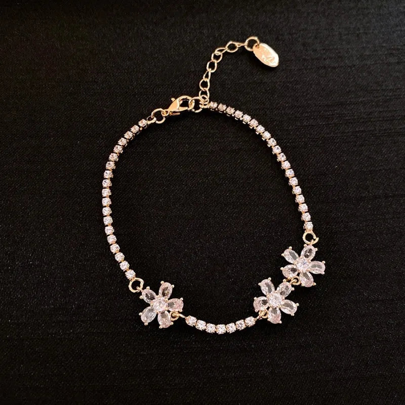 Gold colour copper bracelet with geometric quadrilateral design and inlaid zircon stones
