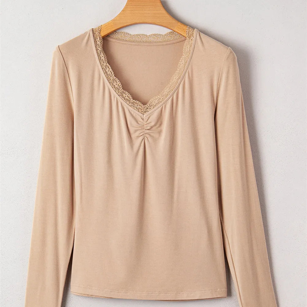 Women's red slim fit long sleeve top with white lace trim on the sleeves.