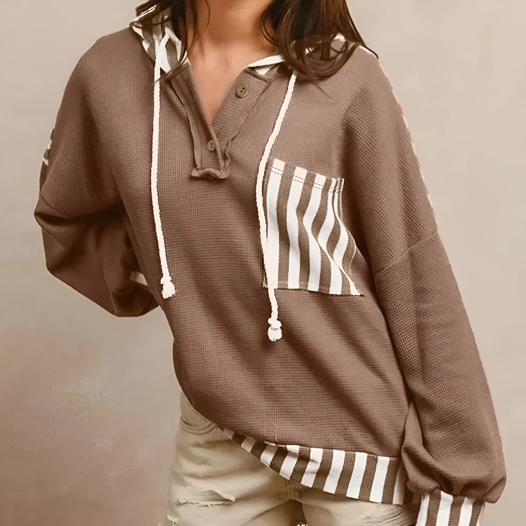 Straw yellow waffle texture hoodie with patchwork stripes, drawstring hood, and button neck detail