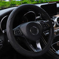 Black and red corrugated PU leather steering wheel cover for 37-38cm diameter wheels.