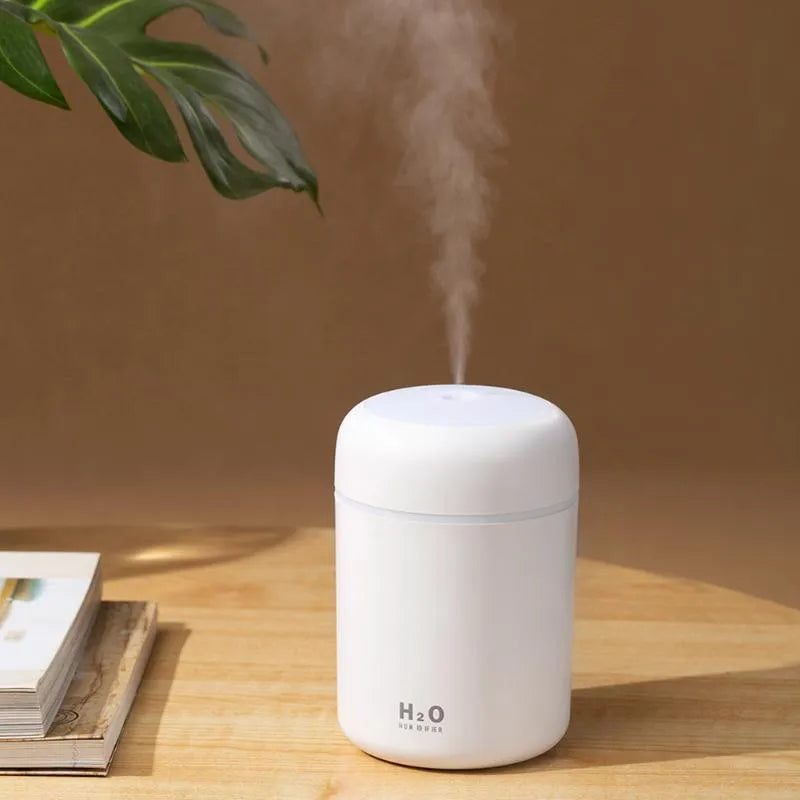Pink USB desktop humidifier with mood lights and water tank