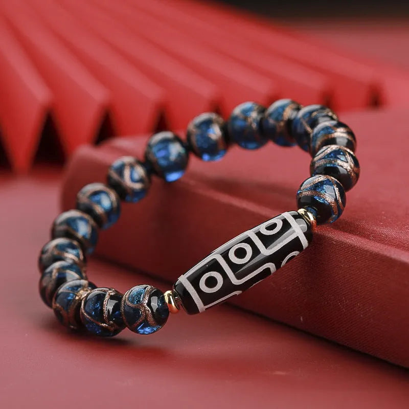 Close-up of a colourful Chinese snake year lucky bead bracelet made from hand-strung coloured glaze.