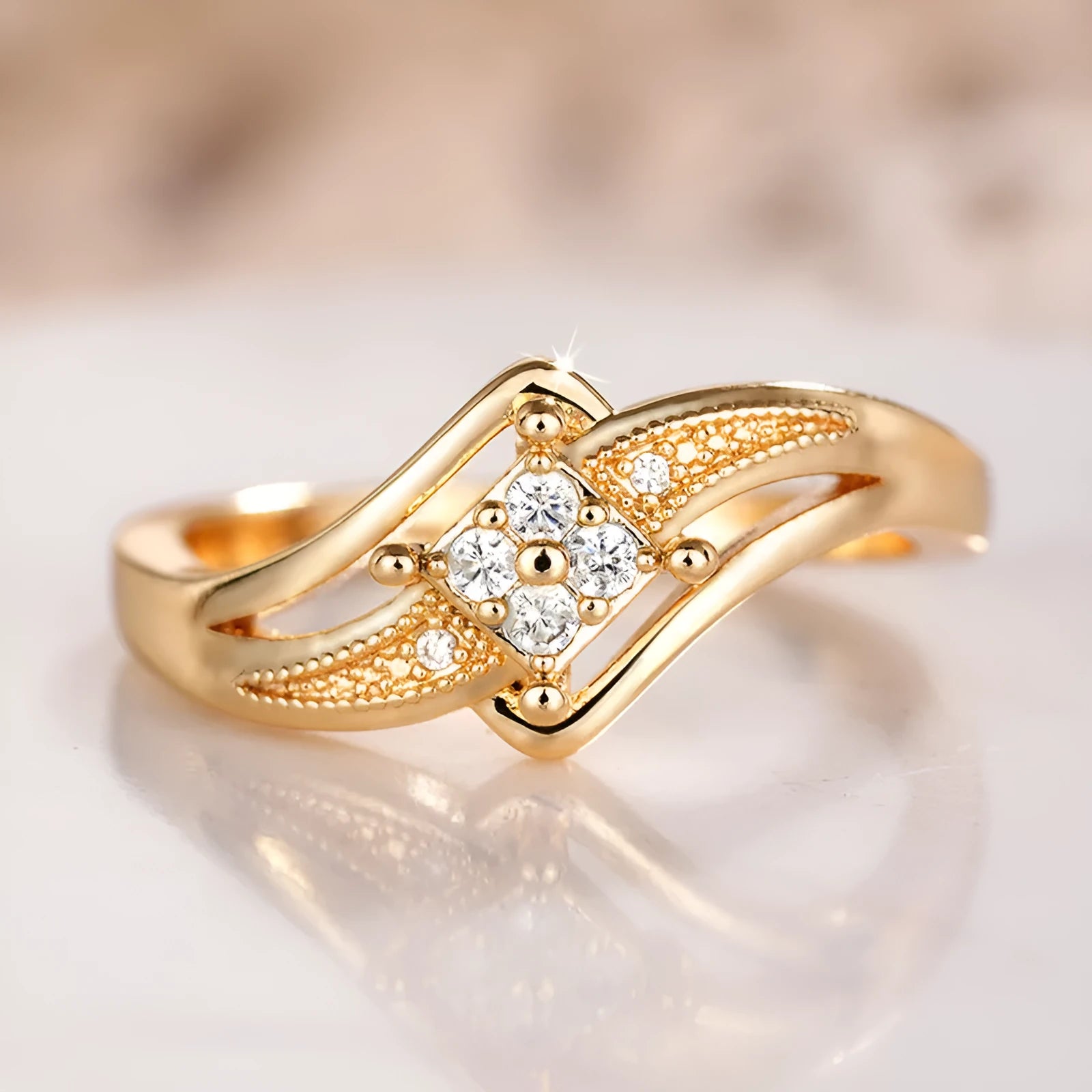 Diamond-shaped yellow gold tone copper ring with micro-inlaid zircon stones on finger