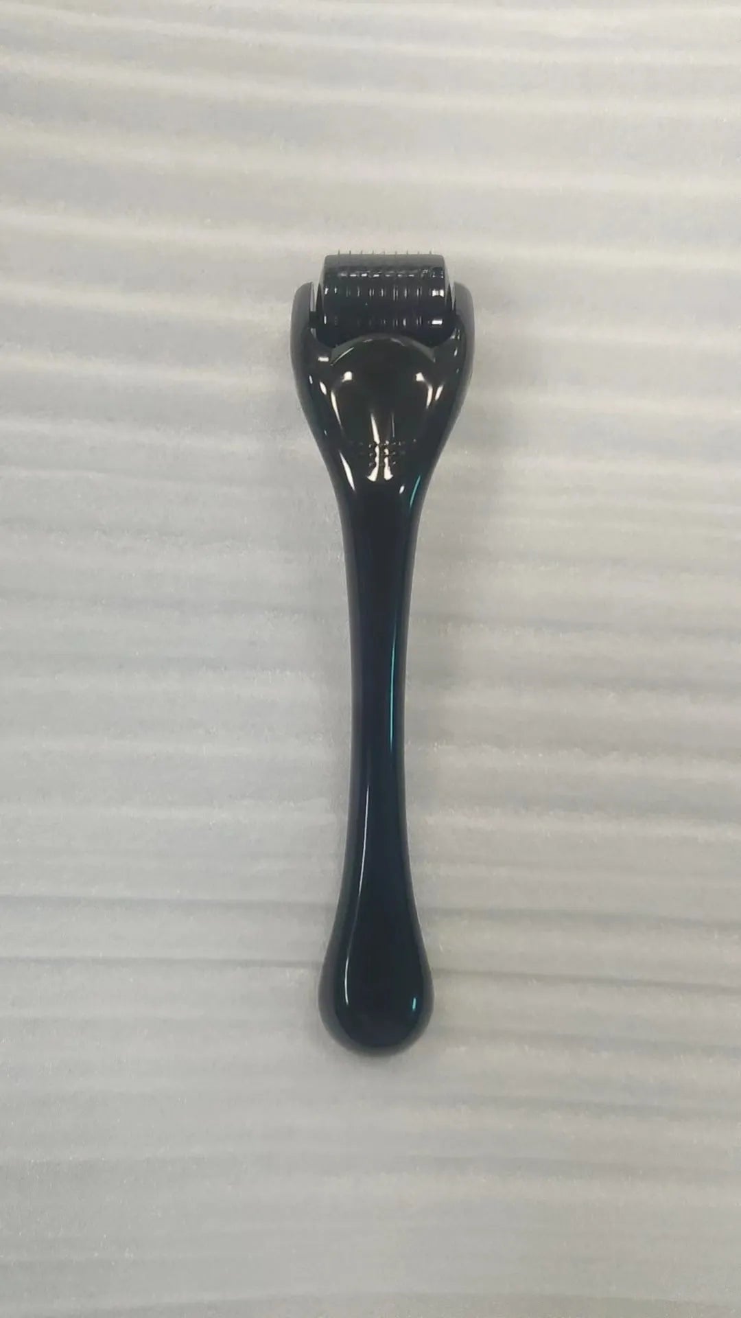 540 needle derma roller micro needling device with black handle and purple roller wheel