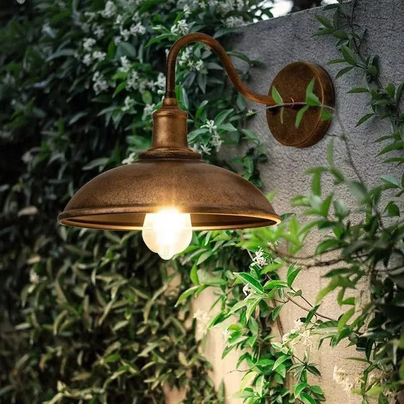 Retro-style outdoor wall lamp in a choice of silver or copper finish with angled arms.