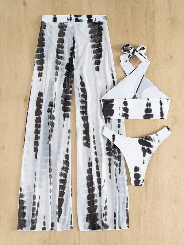 Women's black printed three-piece swimsuit set with mesh trousers, bikini top, and briefs.