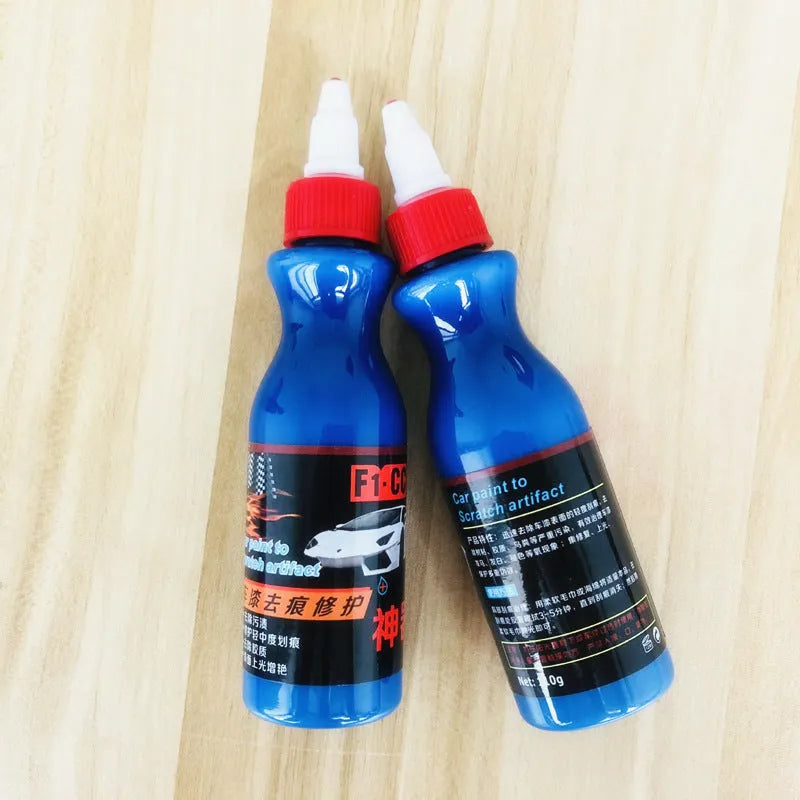 Small blue car wiping tool with scratch repair agent bottle for automotive paint touch-ups