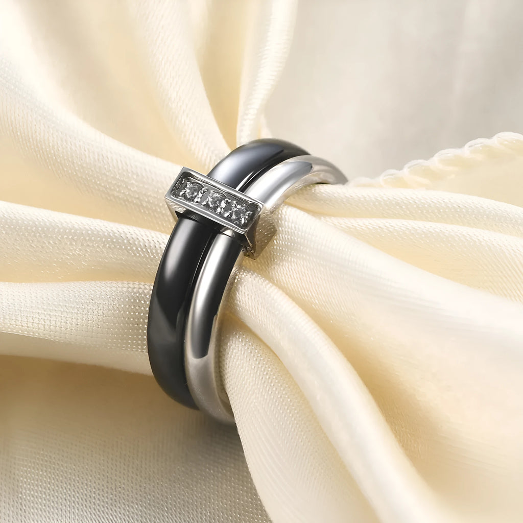 Ceramic geometric women's ring with glossy stitching and zirconium elements in steel black colour