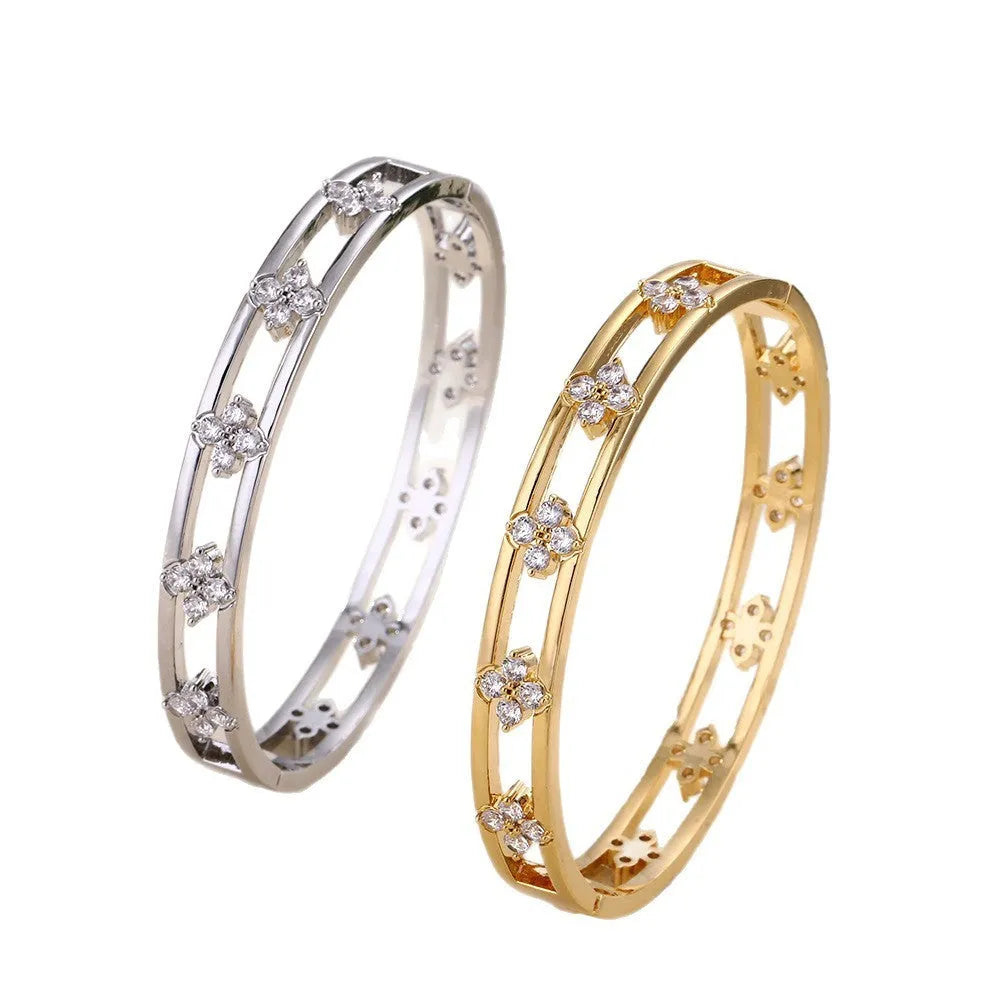 Women's hollow bracelet with four-leaf clover charm and zircon inlay in gold or silver colour