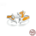 Adjustable silver ring with a raised cartoon corgi dog design on the band.