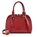 Shiny PU leather crossbody bag in shell shape design showing black, red and brown colour options