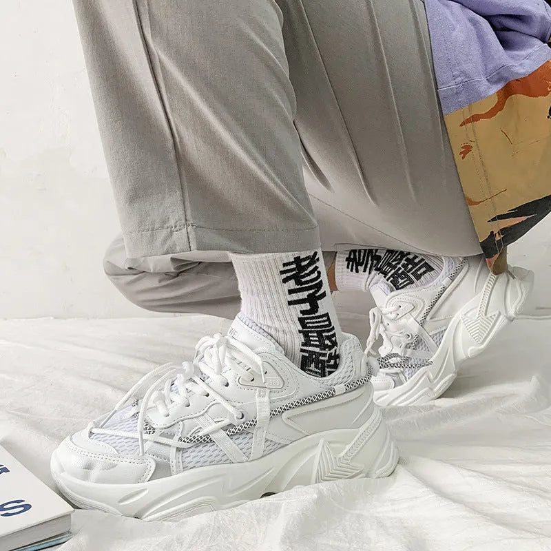 Men's white platform sneakers with lace-up front, shown on a neutral background.