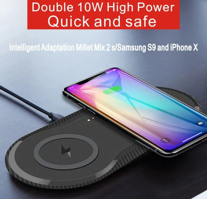 Black and white dual wireless charging pad with two smartphone charging surfaces and anti-slip silicone base