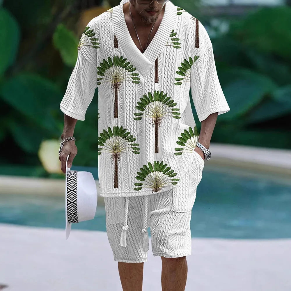 Man wearing a loose-fitting light blue short sleeve top and matching shorts casual suit set.