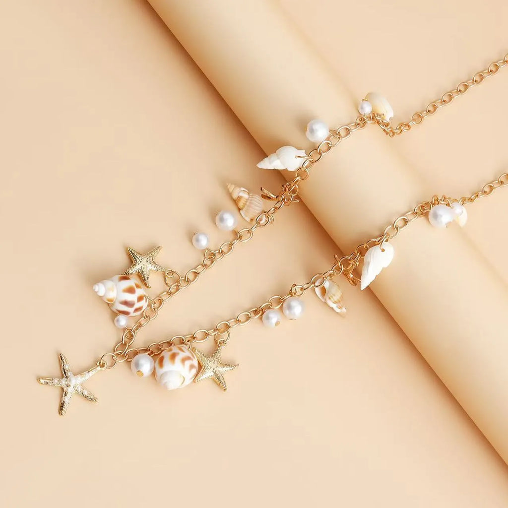 Women's waist chain and bracelet jewellery set with star shell design for beachwear