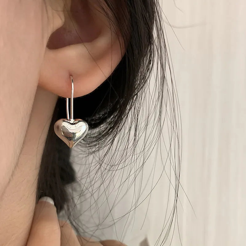 Korean style 3D heart-shaped earrings with glossy finish and silver colour