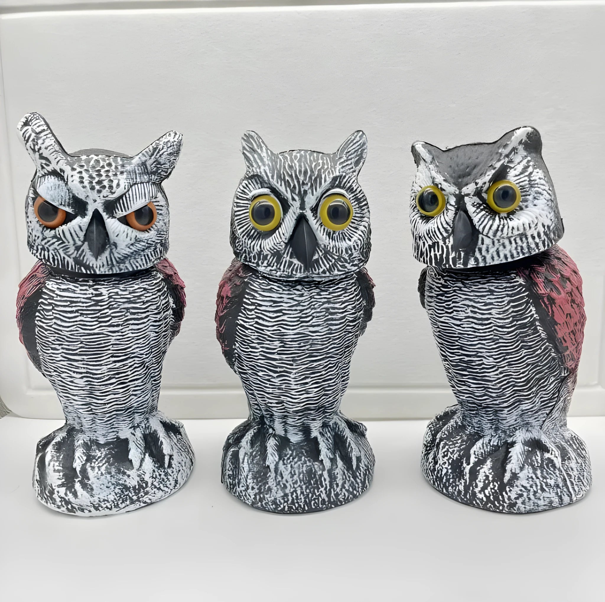 Realistic plastic artificial owl bird deterrent ornament with shaking head, for outdoor use.