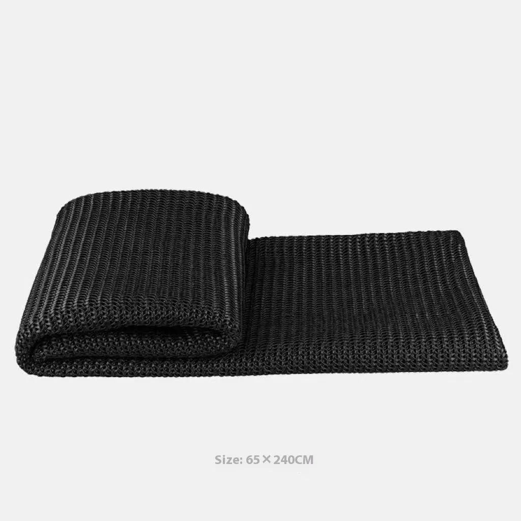 Modern minimalist grey and white plaid bed runner blanket with matching pillowcase and round leather pillow