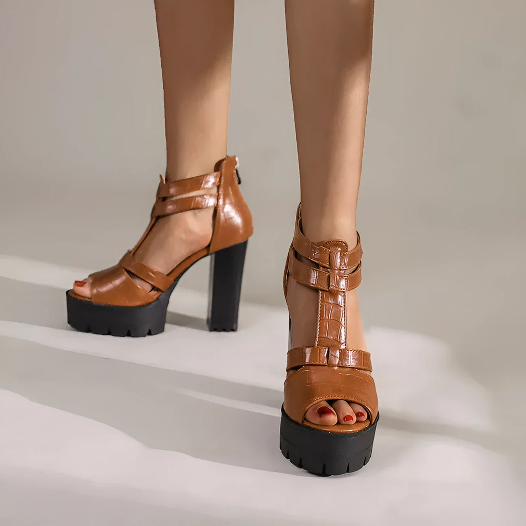 Women's black platform high heel sandals with a back zipper and round toe on a rubber sole.