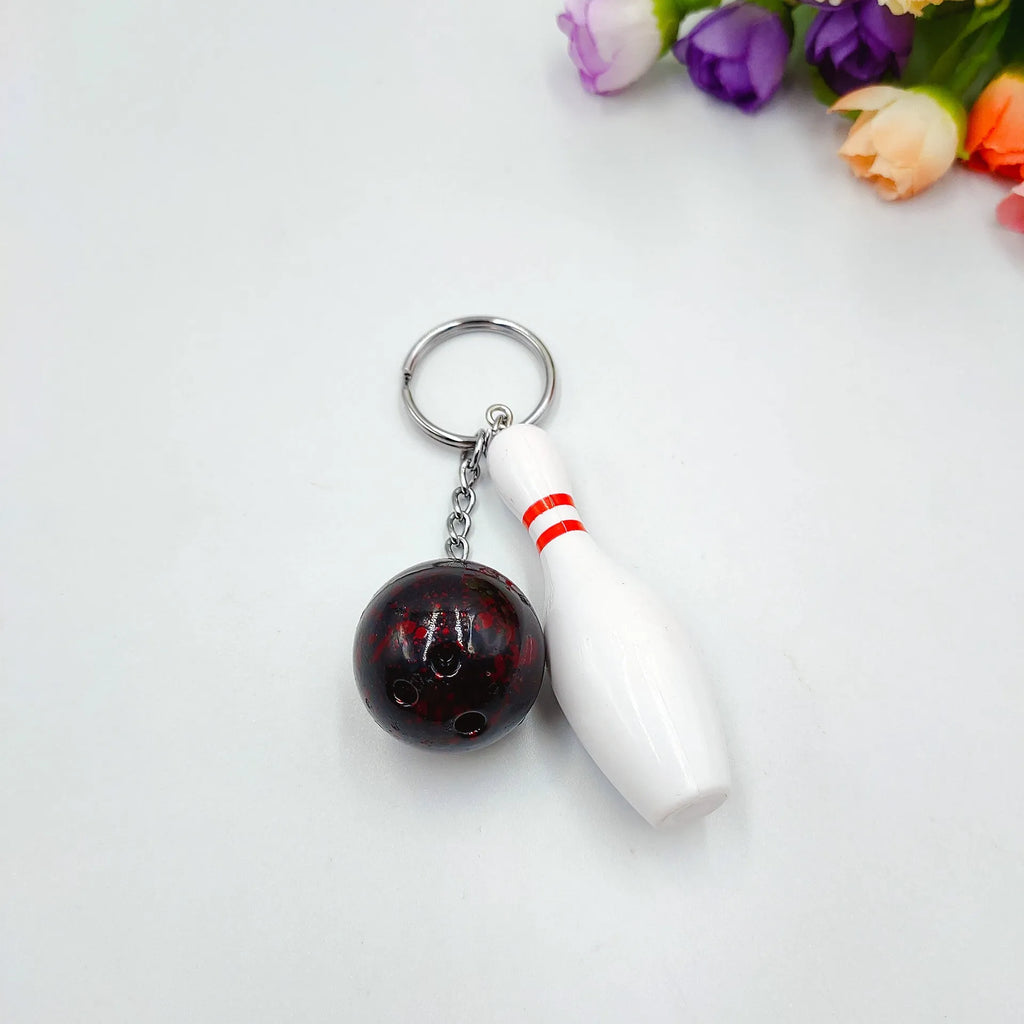 Mini bowling pin simulation keychain pendant in blue colour with metal keyring attachment