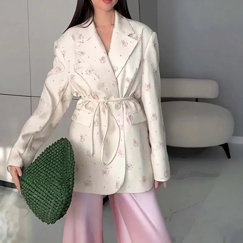 Collar lace-up waist-tight suit jacket in polyester fabric with long sleeves, showing cinched silhouette