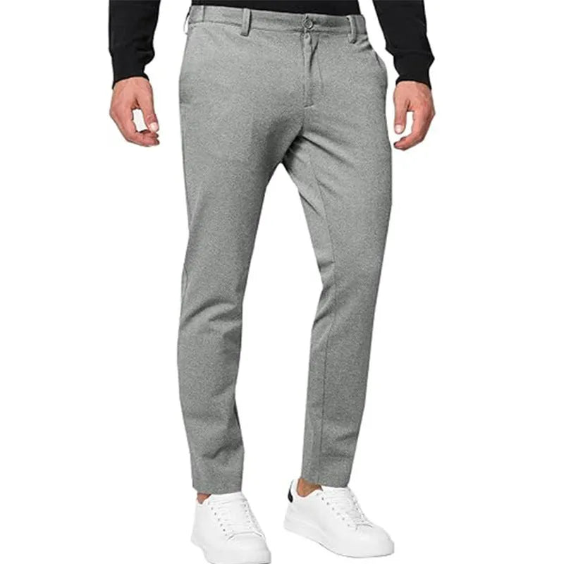 Men's slim-fit tapered chino trousers in a grey colour, showing the casual fit and style.
