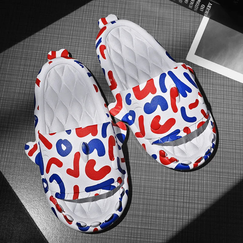 Pair of grey shark design open toe EVA home slippers on a white background.