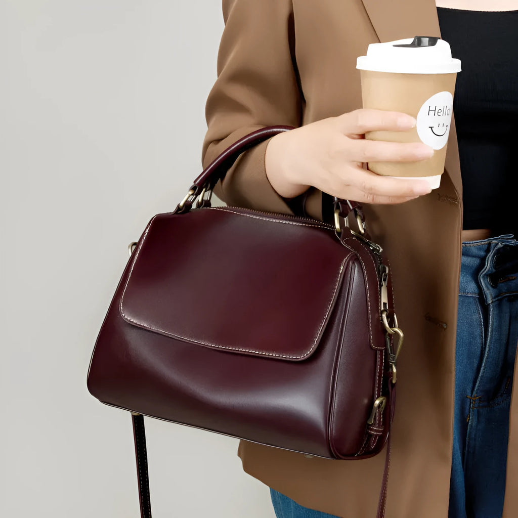 Women's genuine leather crossbody tote bag in apricot colour showing outer slit pocket and double shoulder straps