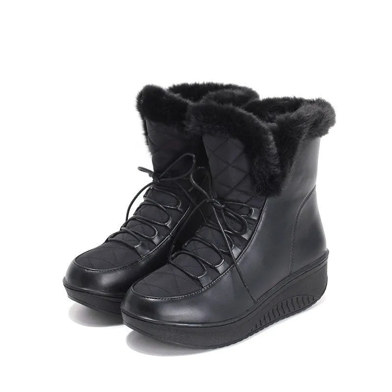 Black women's winter ankle boots with lace-up closure and a platform sole.