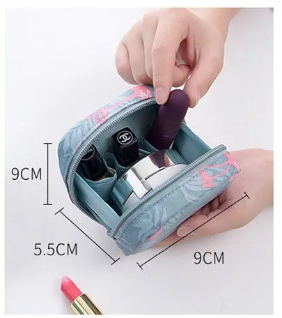 A blue cube-shaped cloth makeup storage bag for organising cosmetics and brushes.