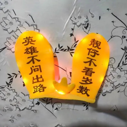 Rabbit Glow Ears helmet decoration with locomotive and ski designs on a Velcro base