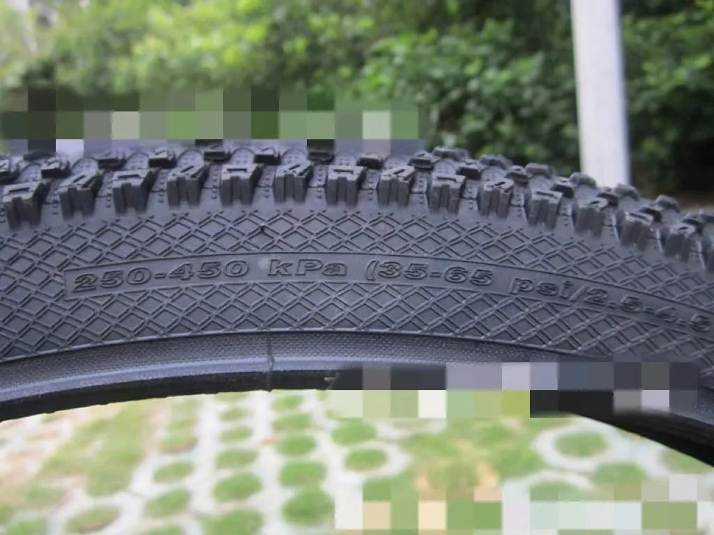 Ultralight mountain bike tyre with reinforced sidewall shown in black, suitable for 26, 27.5 or 29 inch wheels